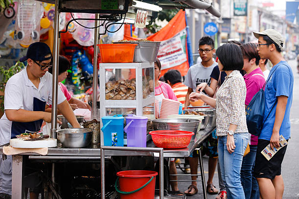 Georgetown, Penang, Malaysia - July 22, 2014: Restoran Kimberly is a very popular local restaraunt in the heart of Georgetown, Penang located on Kimberly Street and is considered to be Penangâs best duck kway chap soup. Kway chap is a Chinese, more specifically Teochew, noodle soup that consists of flat wide rice noodle rolls, served in some kind of a meat based broth.