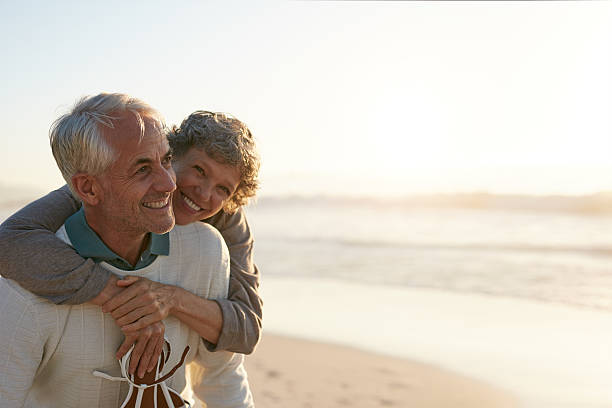 istock Senior couple having fun at the beach 629225096