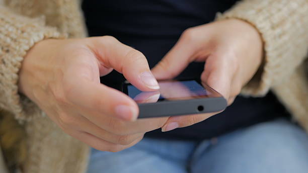 istock Close-up woman hands using smartphone 629225396
