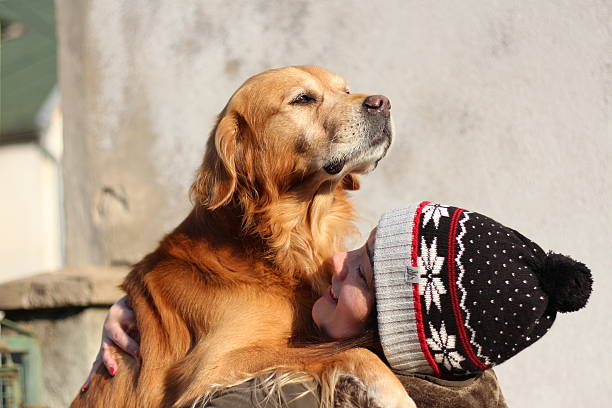 istock young girl hugging her dog 629225724
