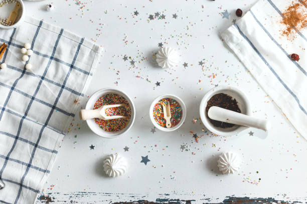 istock Three saucer with candy sprinkles, surrounded by sweets. Top View 629225734