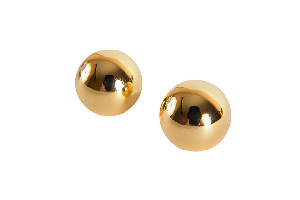 istock Golden vaginal balls isolated on a white background 629225886