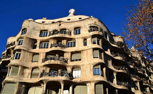 Barcelona, Spain - December 29, 2012: Casa Mila or La Pedrera in Barcelona. This building was designed by Antoni Gaudi and it is one of the main tourist attractions of Barcelona, Spain.
