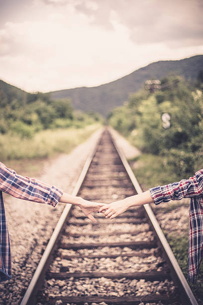 istock Couple walking on railroad 629227564
