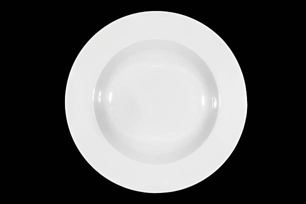 istock Soup deep round plate on black background from above 629228242