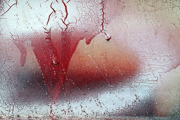 istock Cracked and dripping red and white paint on grunge metal 629228314