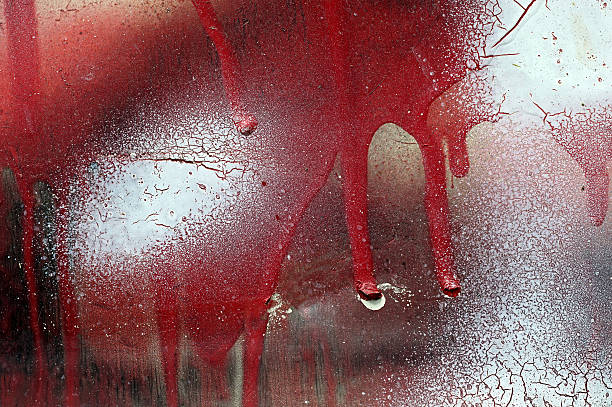 istock Cracked and dripping red and white paint on grunge metal 629228446