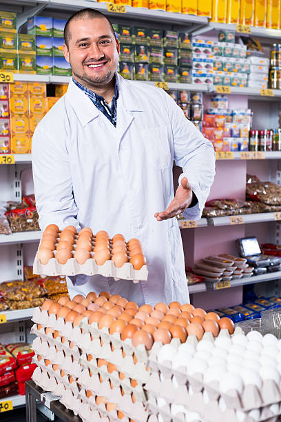istock Man selling eggs in marketplace 629230700