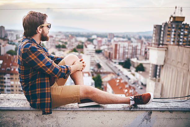 istock Man enjoying on rooftop of his building 629237850