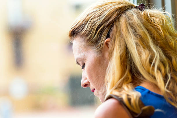 istock Pensive Mature blond woman 629237900