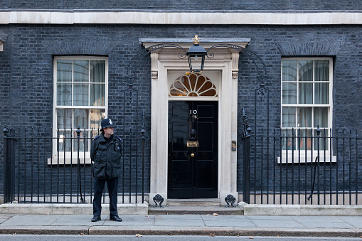 London, United Kingdom - November 28, 2016: A guard in front of 10 Downing Street in London, the residence of Prime Minister of the United Kingdom.
