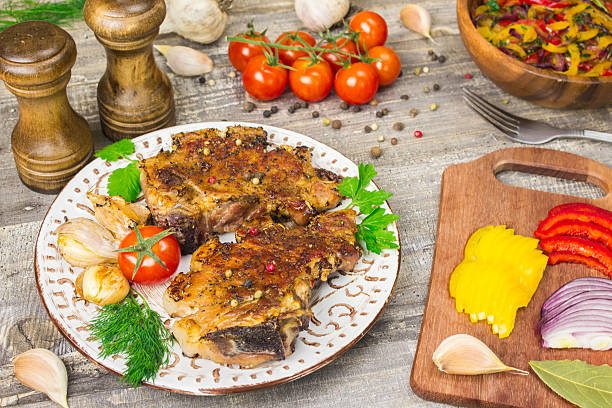 istock Roasted meat, tomatoes, peppers, onions sliced vegetables on a white 629239266