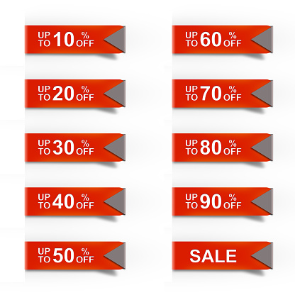 Red discount labels bent around paper