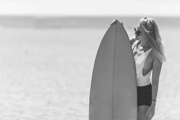 istock Surf girl in black and white 629247322