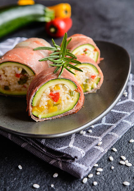 istock Zucchini stuffed with rice, cheese, pepper and wrapped in Prosci 629248946