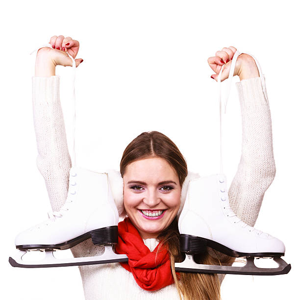 istock Smiling woman with ice skates 629254730