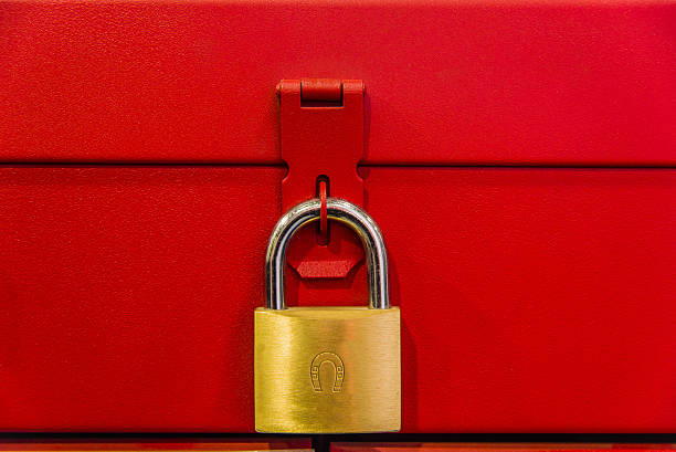 istock yellow lock hanging on red box background, , 629254762