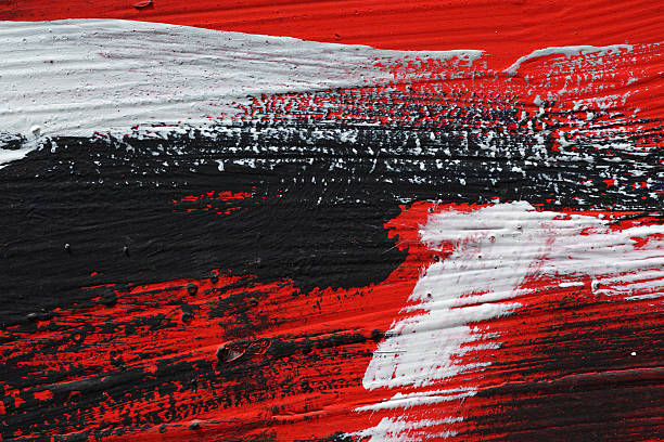 Black, white, red acrylic paint on metal surface. Brushstroke 6 stock photo