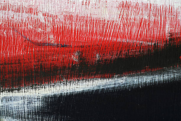 Black, white, red acrylic paint on metal surface. Brushstroke 5 stock photo