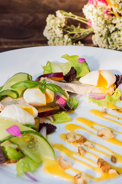 istock Salad of stewed meat, green, perepilinyh poached eggs, cucumbers, basil 629258152