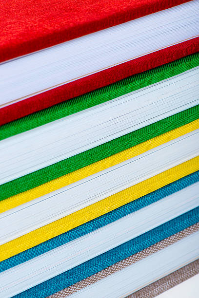 istock Multicolored book textile cover. Photobooks on a white background. 629263148