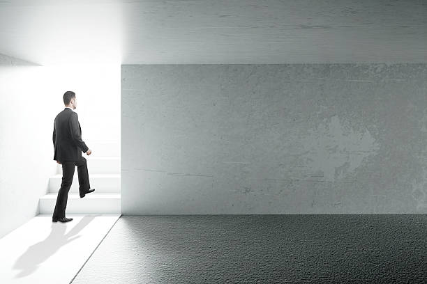 istock Businessman and blank wall 629263366