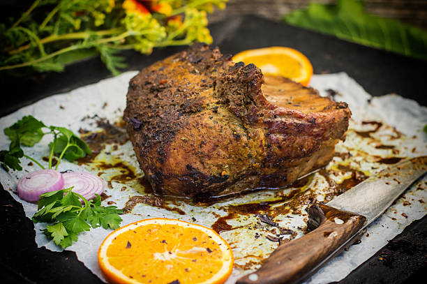 istock Baked pork ribs with sauce and basil on a black 629265006