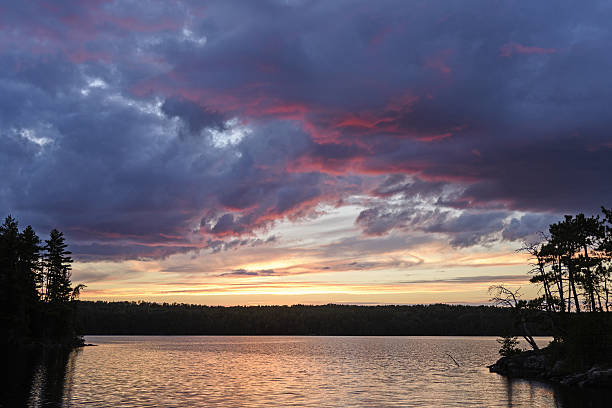 istock Purple Clouds and Silhouettes ar Sunset 629266096