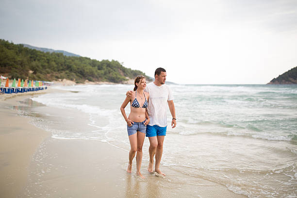 istock Happiness couple walking on beach 629267454