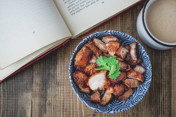 deep fried pork and the book on wooden