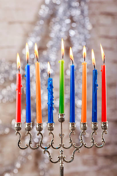 istock Menorah with candles for Hanukkah against defocused lights 629276336