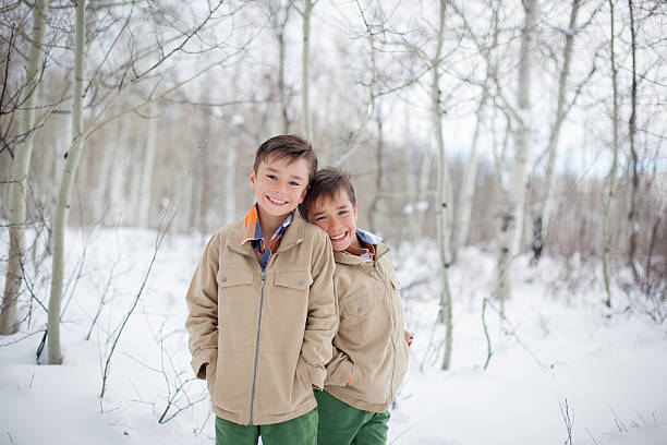 istock Young Boy Brothers Outdoors in Winter Deep Snow 629276624