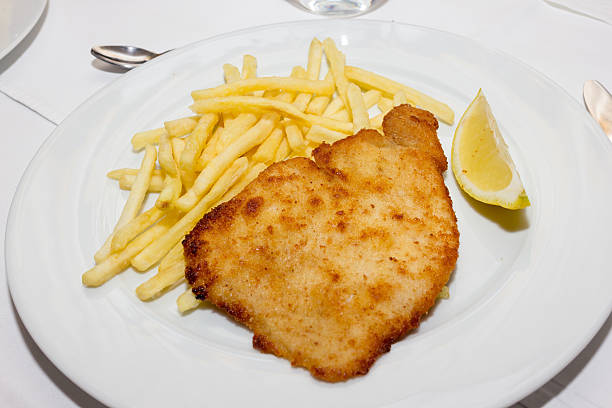 istock Tasty schnitzel with potato chips 629277048