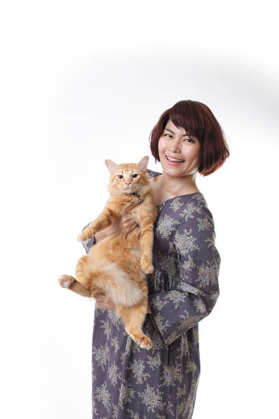 Asian woman The Asian woman on the white background. short haired maine coon stock pictures, royalty-free photos & images