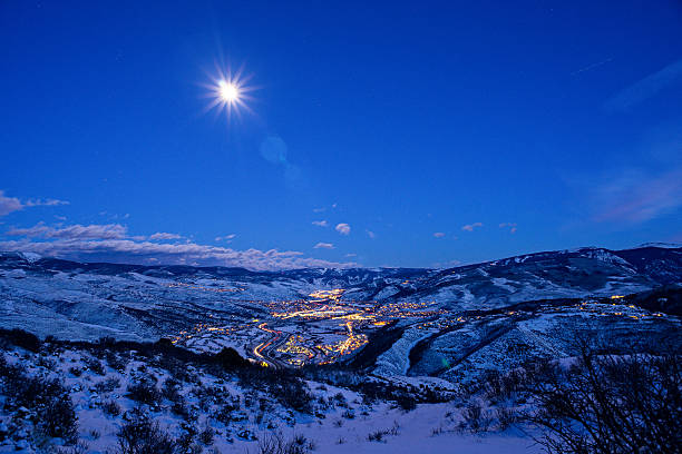 Vail Valley at Night Vail Valley at Night - Vail Colorado view of entire valley at dusk with blue hour light and town lit up with lights and mountain views. blue hour twilight stock pictures, royalty-free photos & images
