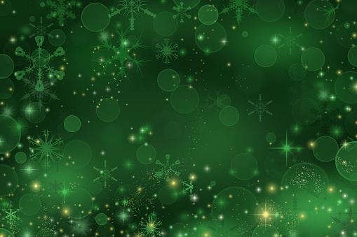 Green Christmas background with snowflakes and sparkles