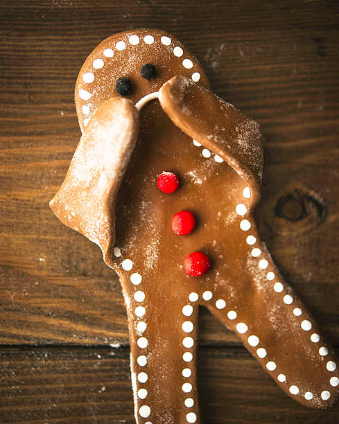 istock Sad little gingerbread man covering his face 629292240