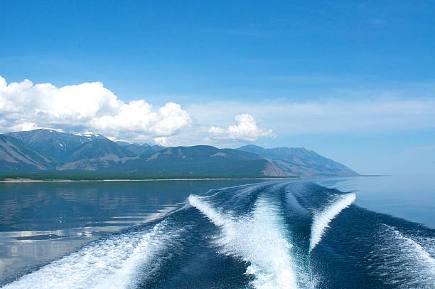 istock waves from a boat on Lake Baikal with mountain background 629293152