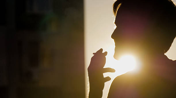istock Portrait of a lonely man smoking  cigarette 629293526