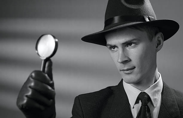 istock Young vintage detective holding a magnifying glass 629294206