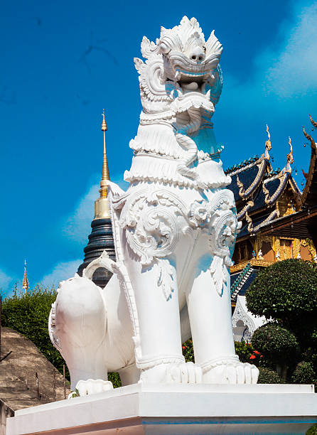 istock Leo statue and temple roof with sky background 629295924