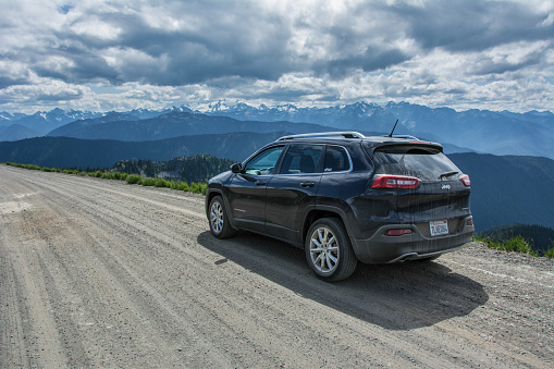 Olympic National Park, Washington, USA - June 17, 2015: Jeep Cherokee on a country road in the mountains of Olympic National Park