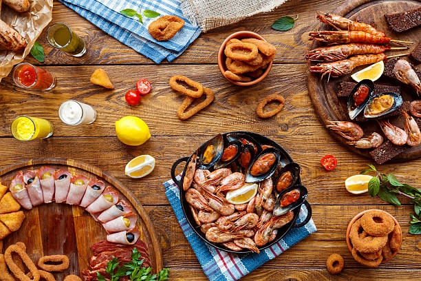 istock Seafood platter top view, flat lay on wooden table background 629306408