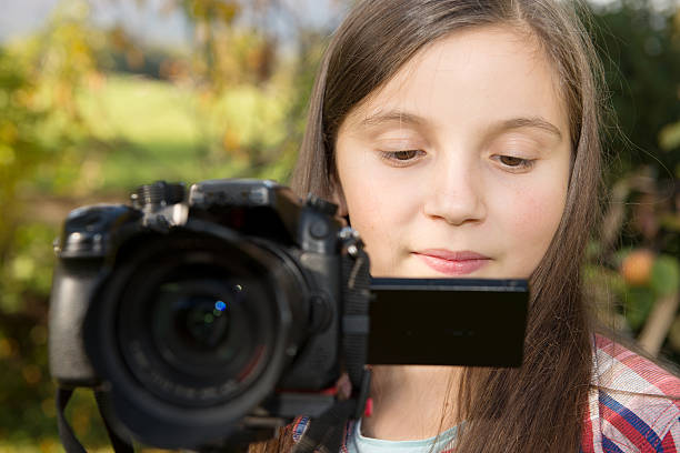 istock Teenage girl with a camera 629307110