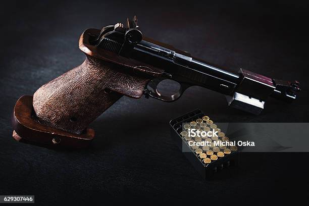 Gun And Bullets On The Table Stock Photo - Download Image Now - Activity, Aiming, Ammunition
