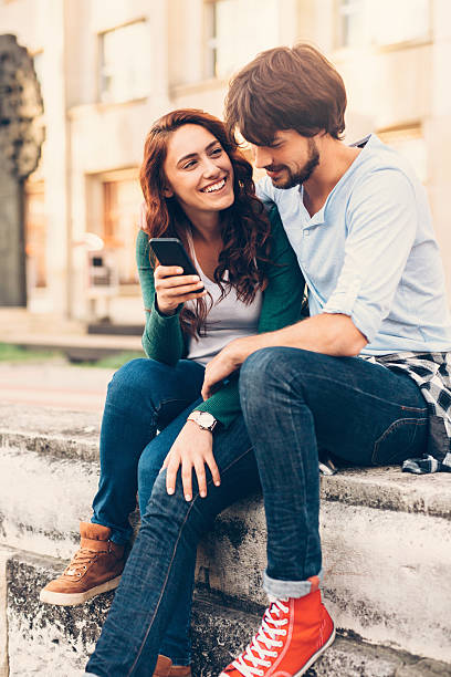 istock Couple texting outdoor 629308216