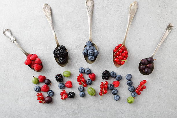 istock concrete food background with berry on spoons 629319546