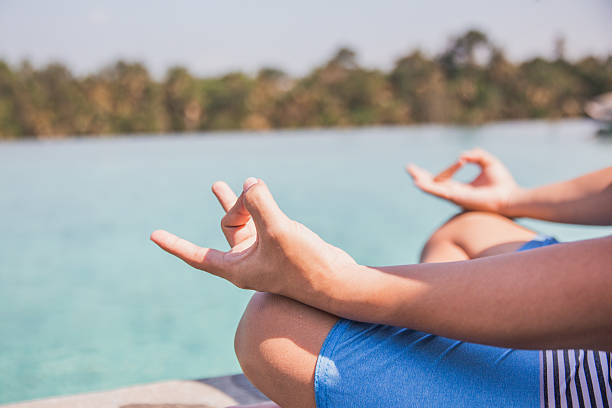 Adult man practicing yoga outdoor