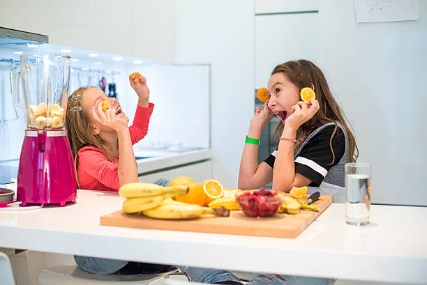 istock Happy girls in the kitchen 629320698