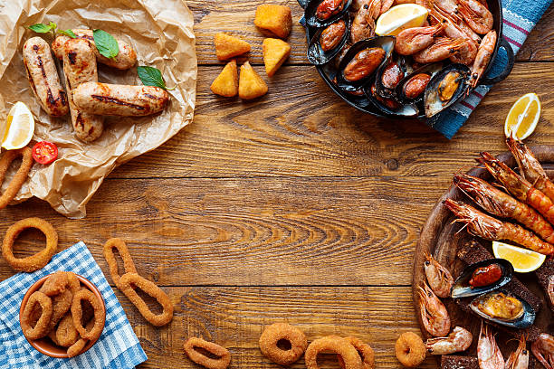 Seafood platter top view, flat lay on wooden table background